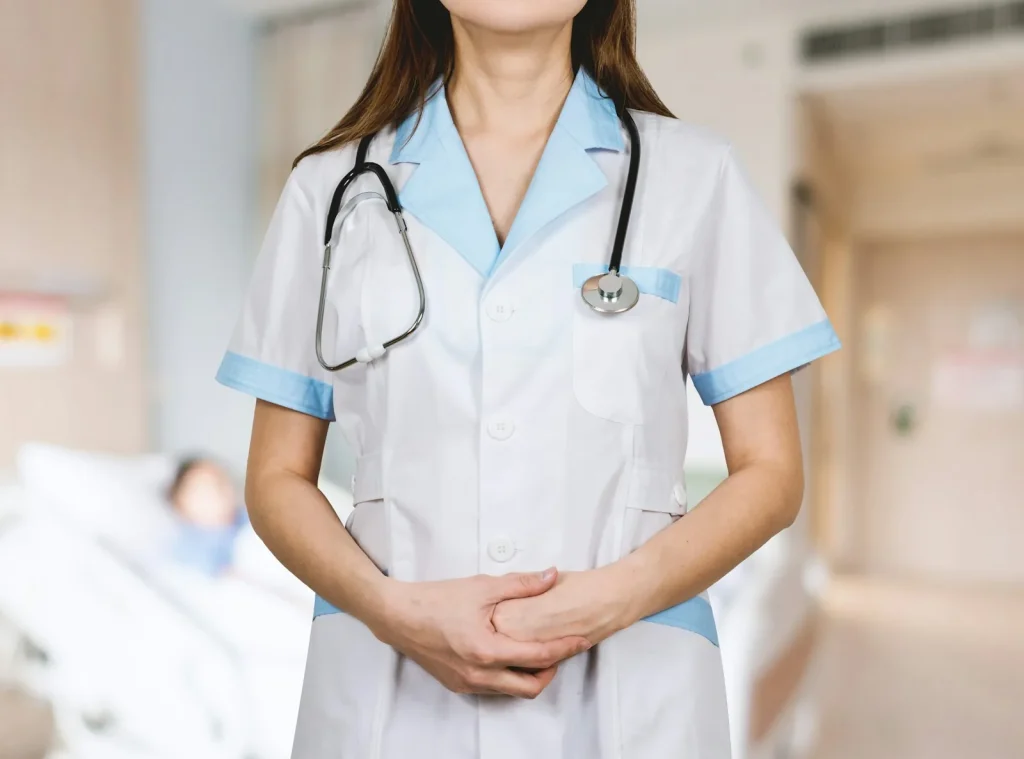 woman in white shirt with blue stethoscope