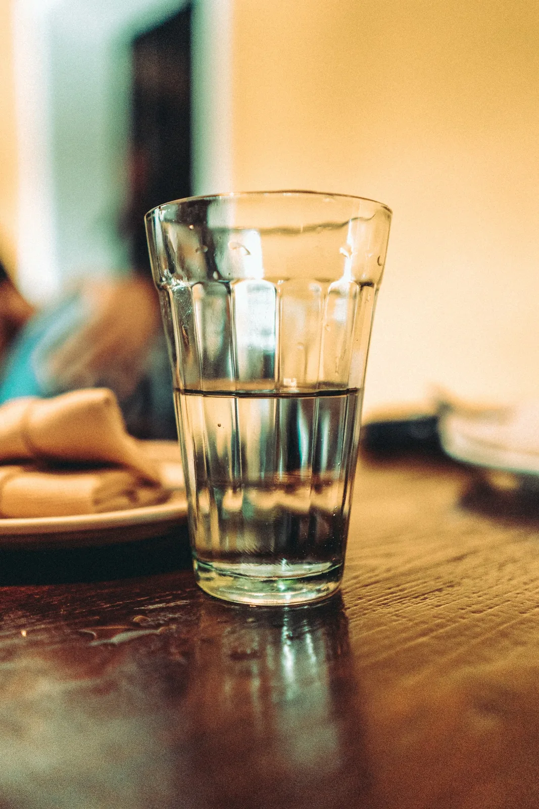 Clear glass of water selective focus photo