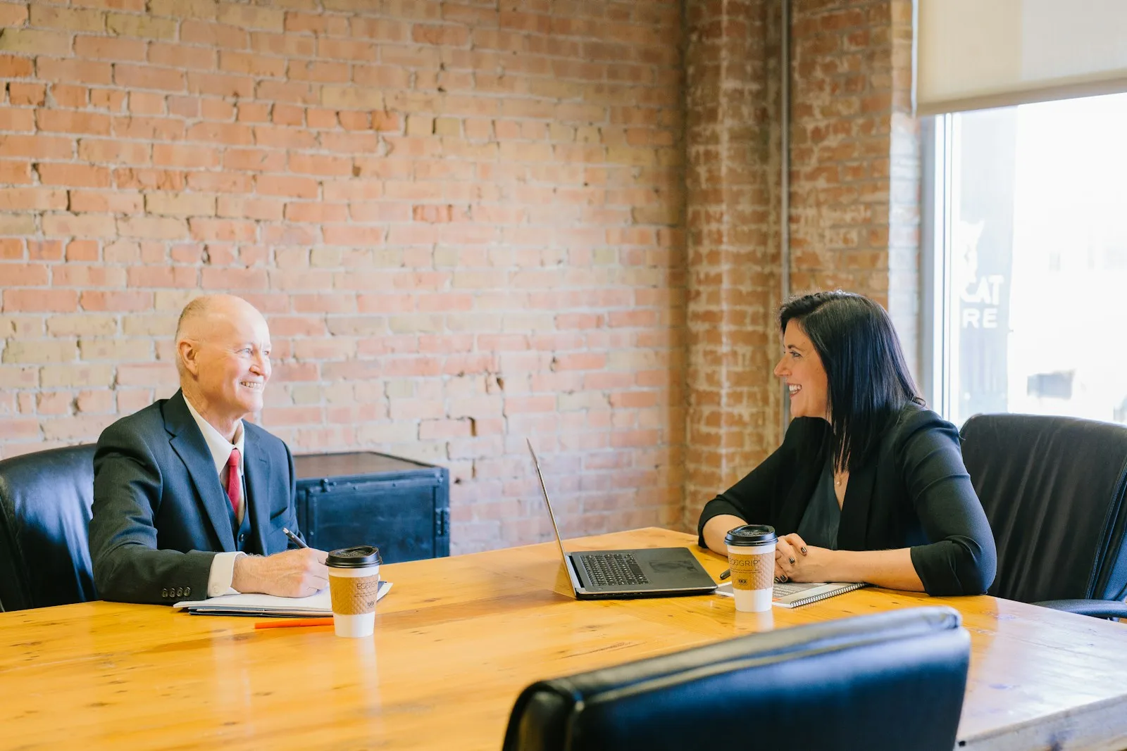 Man and woman talking inside office