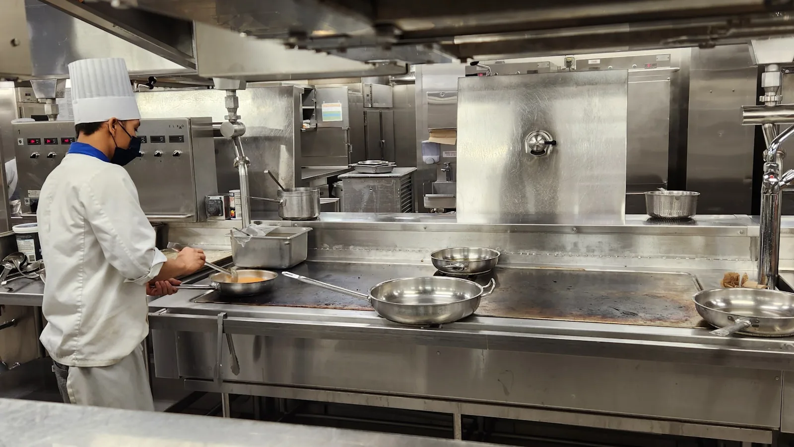 a chef cooking in a kitchen