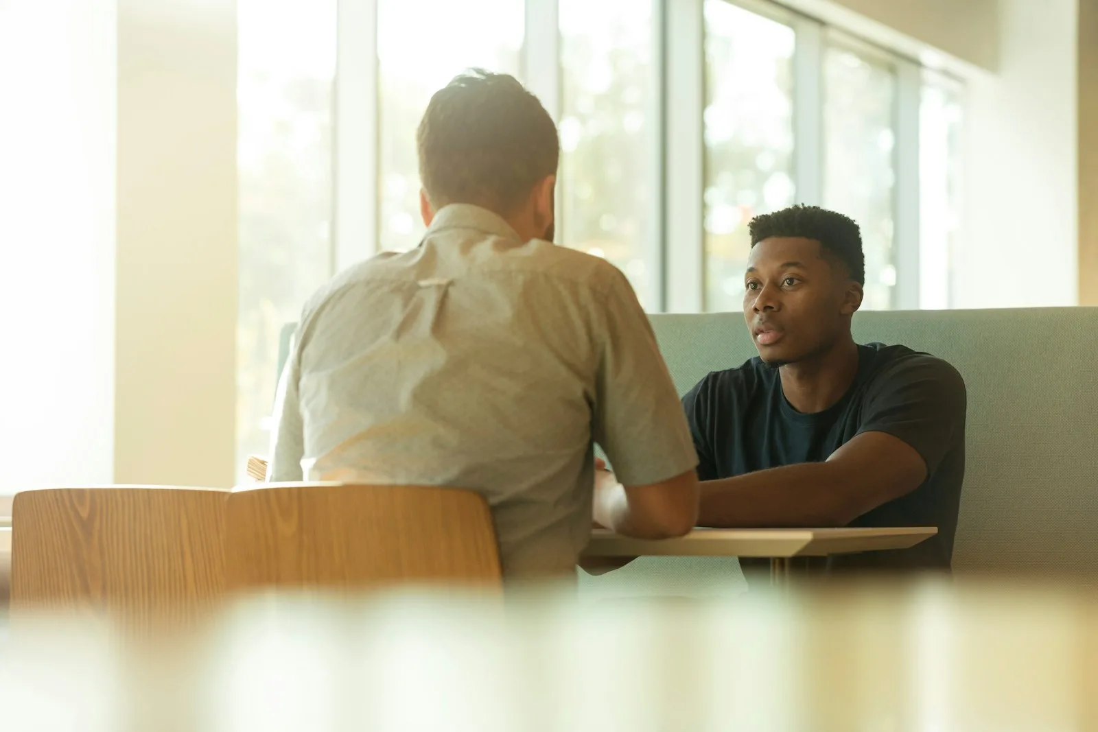 two men talking about business sales